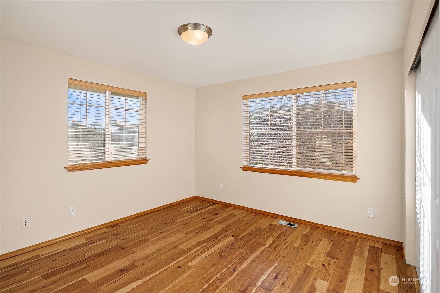 20012 79th Avenue Northeast Kenmore, WA 98028 - Photo 29 of 35 a view of a room with wooden floor and windows