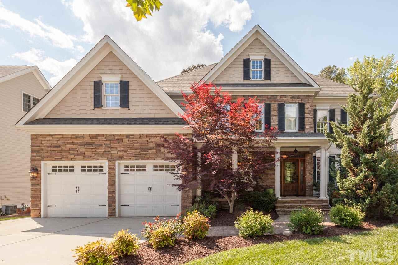 4218 Batiste Road Raleigh, NC 27613 - Photo 2 of 25 BEAUTIFUL STONE EXTERIOR ACCENTS AND ROCKING CHAIR FRONT PORCH.