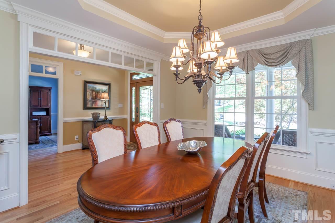 4218 Batiste Road Raleigh, NC 27613 - Photo 12 of 25 EXQUISITE FORMAL DINING ROOM, GREAT FOR ENTERTAINING. BEAUTIFUL CHANDELIER, TREY CEILING, CHAIR AND CROWN MOLDINGS.