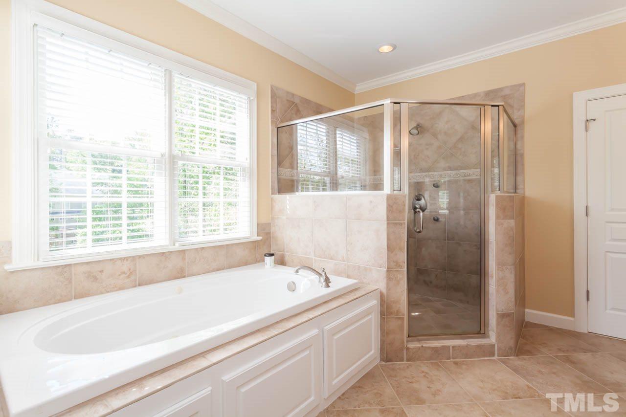 4218 Batiste Road Raleigh, NC 27613 - Photo 20 of 25 ANOTHER GREAT VIEW OF THE GARDEN TUB AND SEPARATE SHOWER WITH TILE SURROUND.