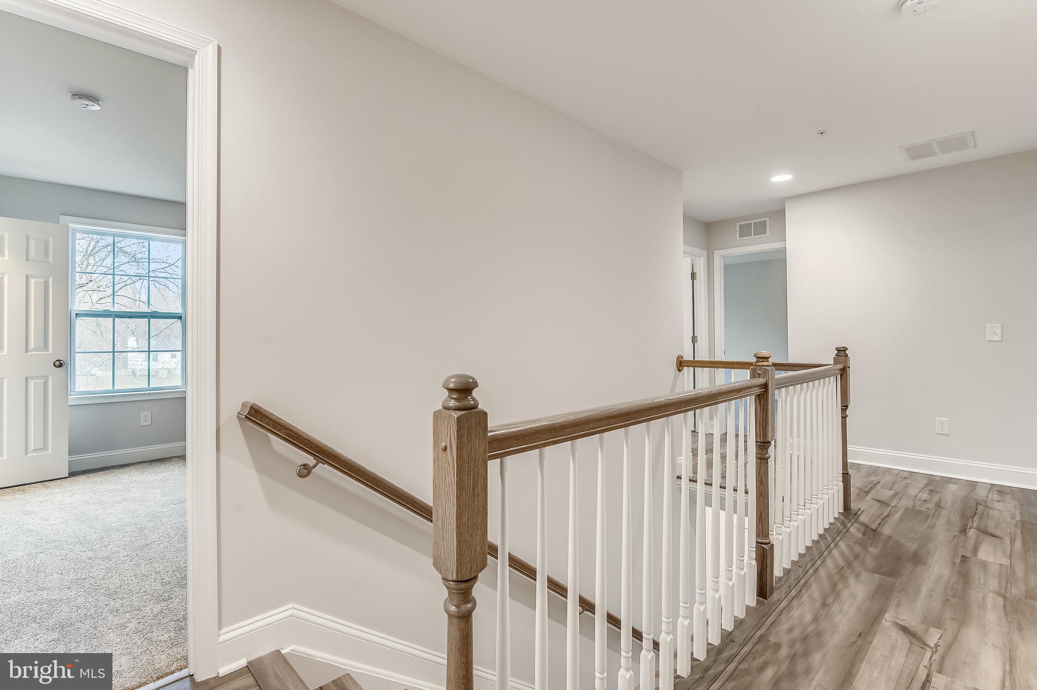 2984 Valley View Road Annapolis, MD 21401 - Photo 15 of 46 Stairway includes oak railing & painted balusters