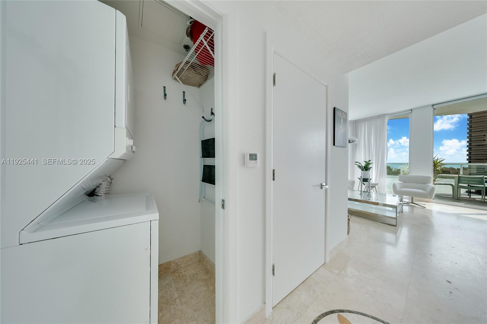 6515 Collins Avenue, Unit 605 Miami Beach, FL 33141 - Photo 12 of 18 a view of kitchen and living room