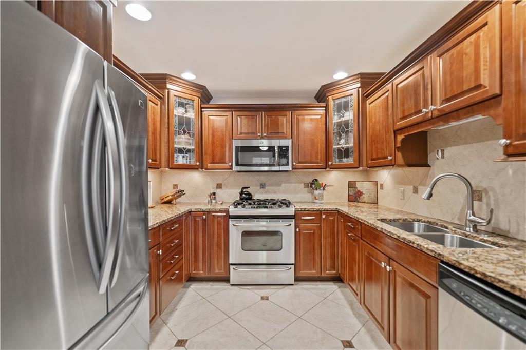 740 Turnpike Street, Unit 7 Beaver, PA 15009 - Photo 10 of 28 Granite countertops, staineless steel appliances, and beautiful cherry cabinetry.