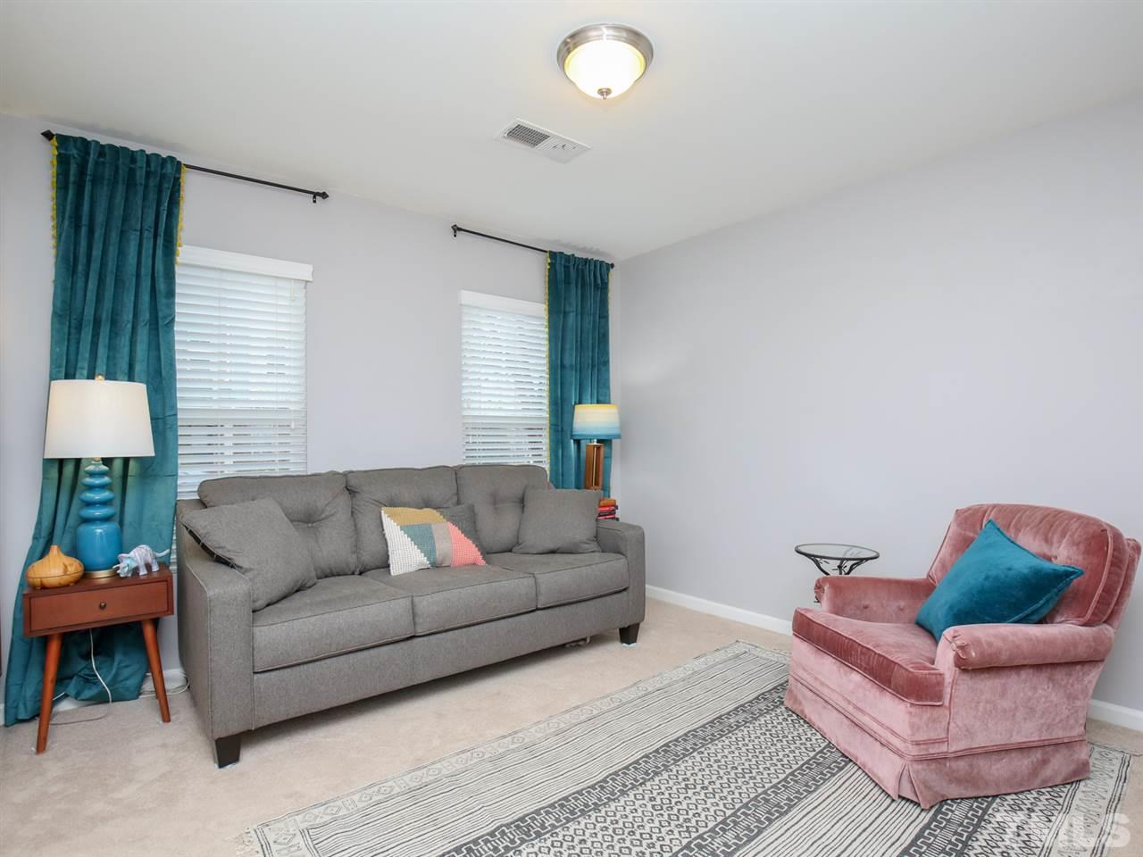 1415 Ardara Lane Raleigh, NC 27607 - Photo 14 of 30 a living room with furniture and a potted plant