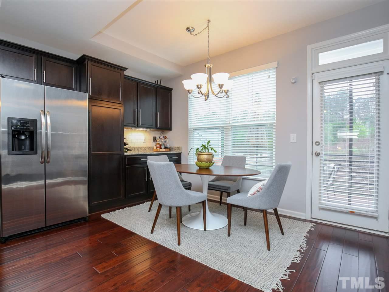 1415 Ardara Lane Raleigh, NC 27607 - Photo 7 of 30 a view of a dining room with furniture window and wooden floor