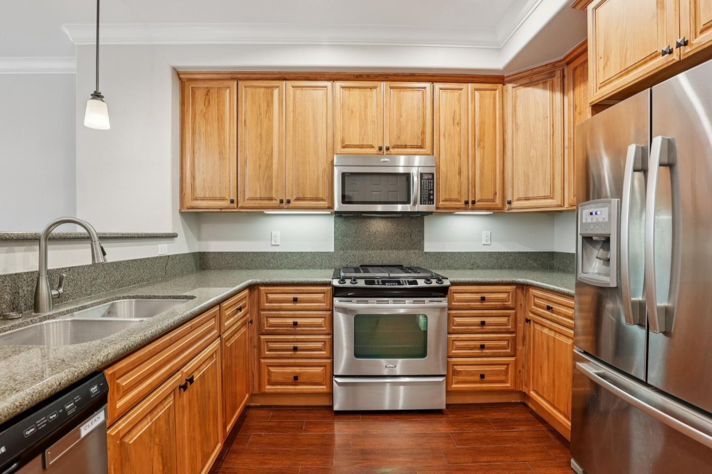 2881 Meridian Avenue, Unit 146 San Jose, CA 95124 - Photo 13 of 35 a kitchen with stainless steel appliances granite countertop a stove a sink and a refrigerator