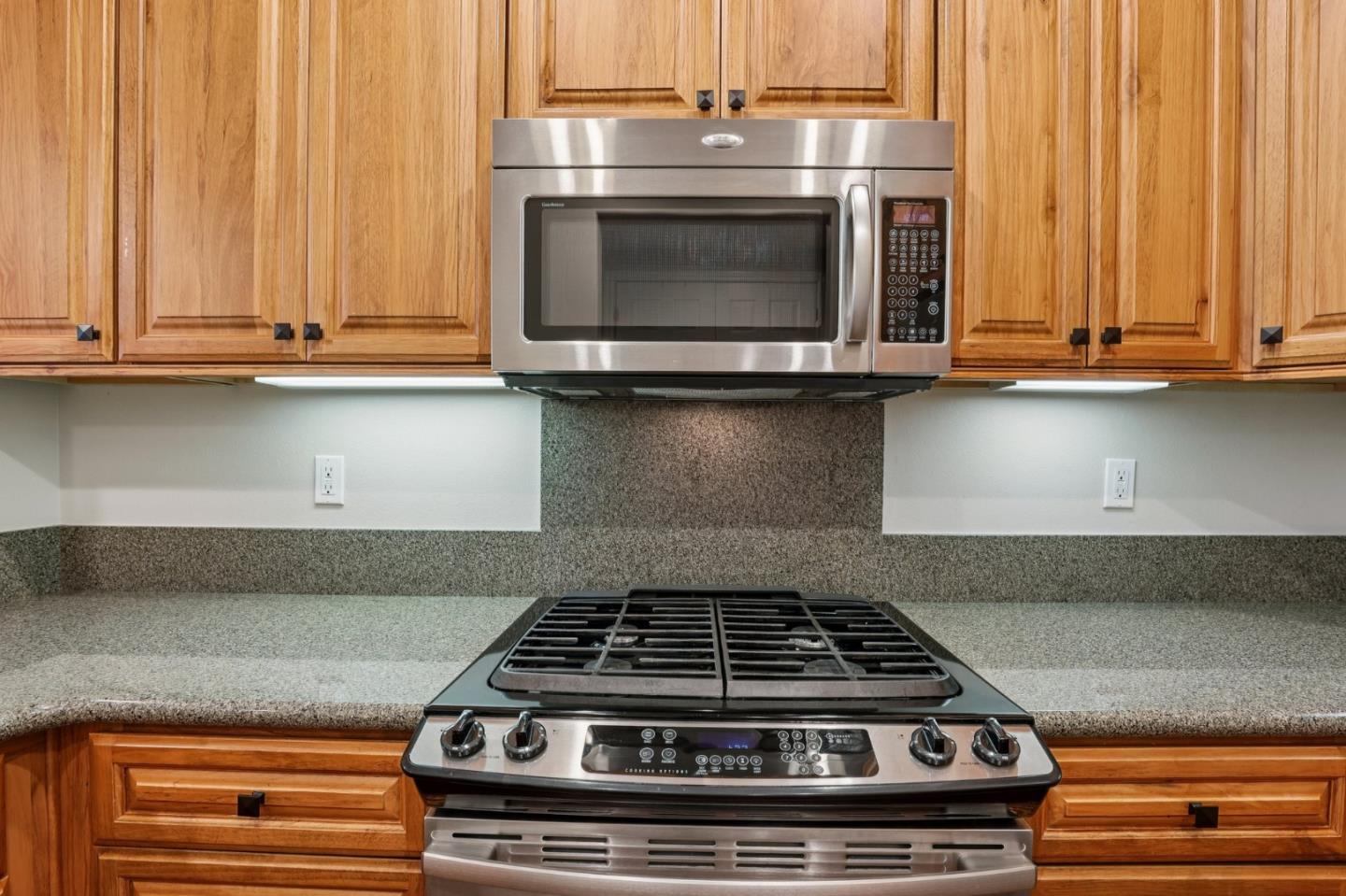 2881 Meridian Avenue, Unit 146 San Jose, CA 95124 - Photo 14 of 35 a stove top oven sitting inside of a kitchen