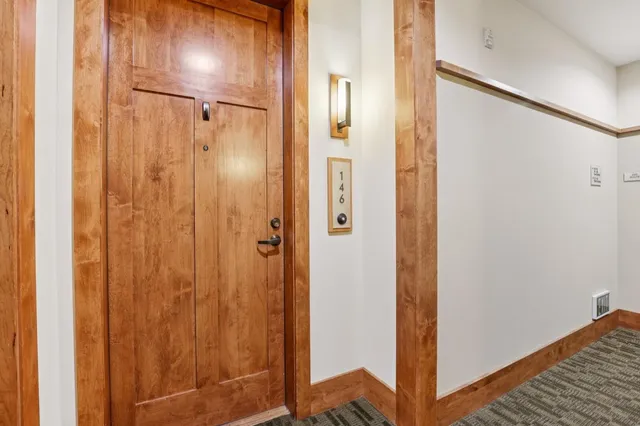 a bathroom with a shower and a mirror