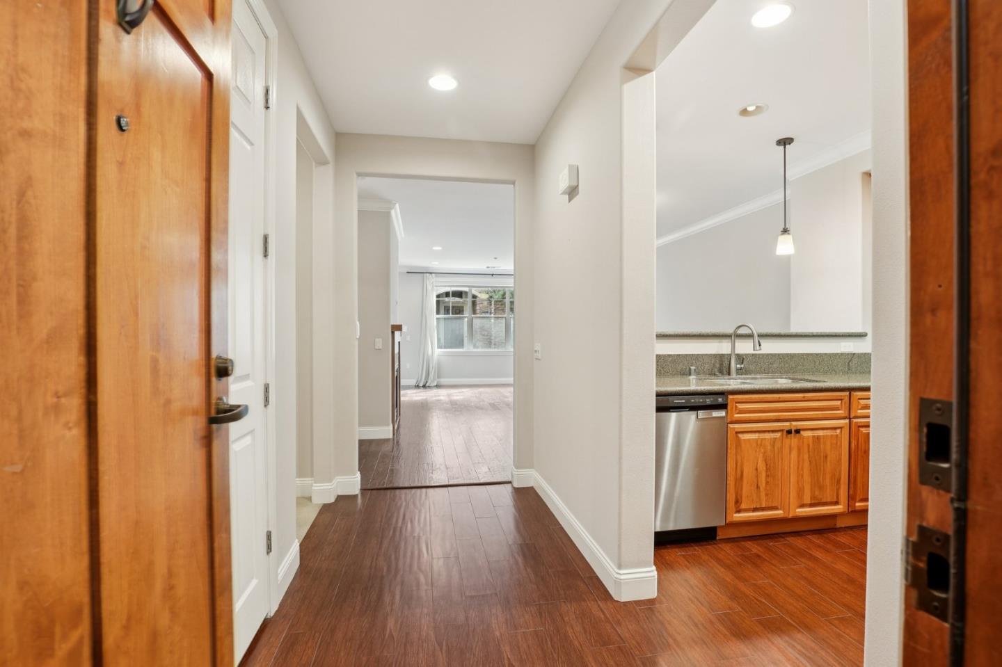 2881 Meridian Avenue, Unit 146 San Jose, CA 95124 - Photo 7 of 35 a view of a hallway with wooden floor and a sink