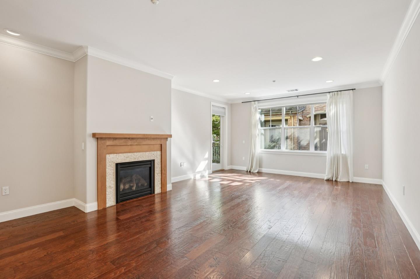 2881 Meridian Avenue, Unit 146 San Jose, CA 95124 - Photo 10 of 35 a view of an empty room with wooden floor and a window