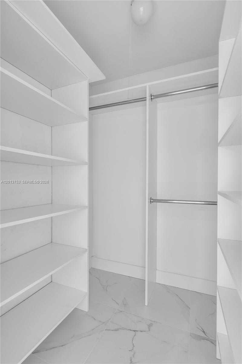 12 Royal Palm Way, Unit 103 Boca Raton, FL 33432 - Photo 11 of 22 a view of an empty walk in closet