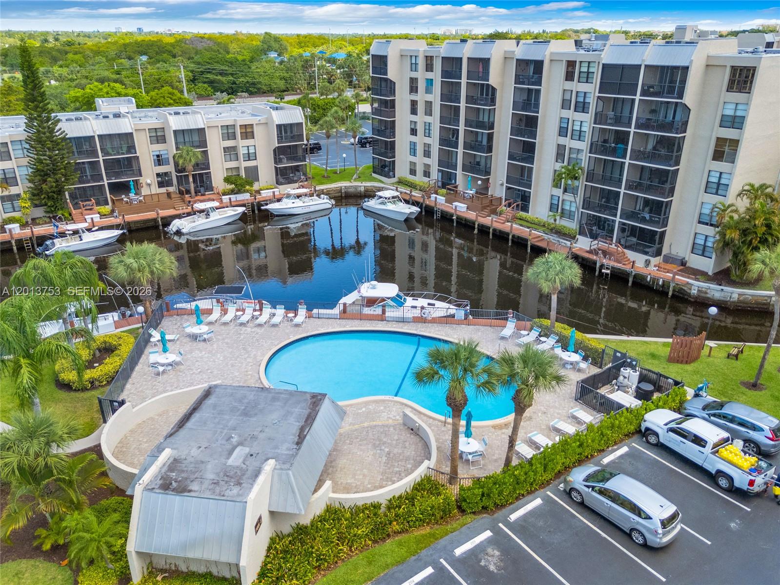 12 Royal Palm Way, Unit 103 Boca Raton, FL 33432 - Photo 19 of 22 a swimming pool with outdoor seating and yard