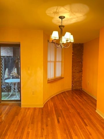 a view of a room with a wooden floor
