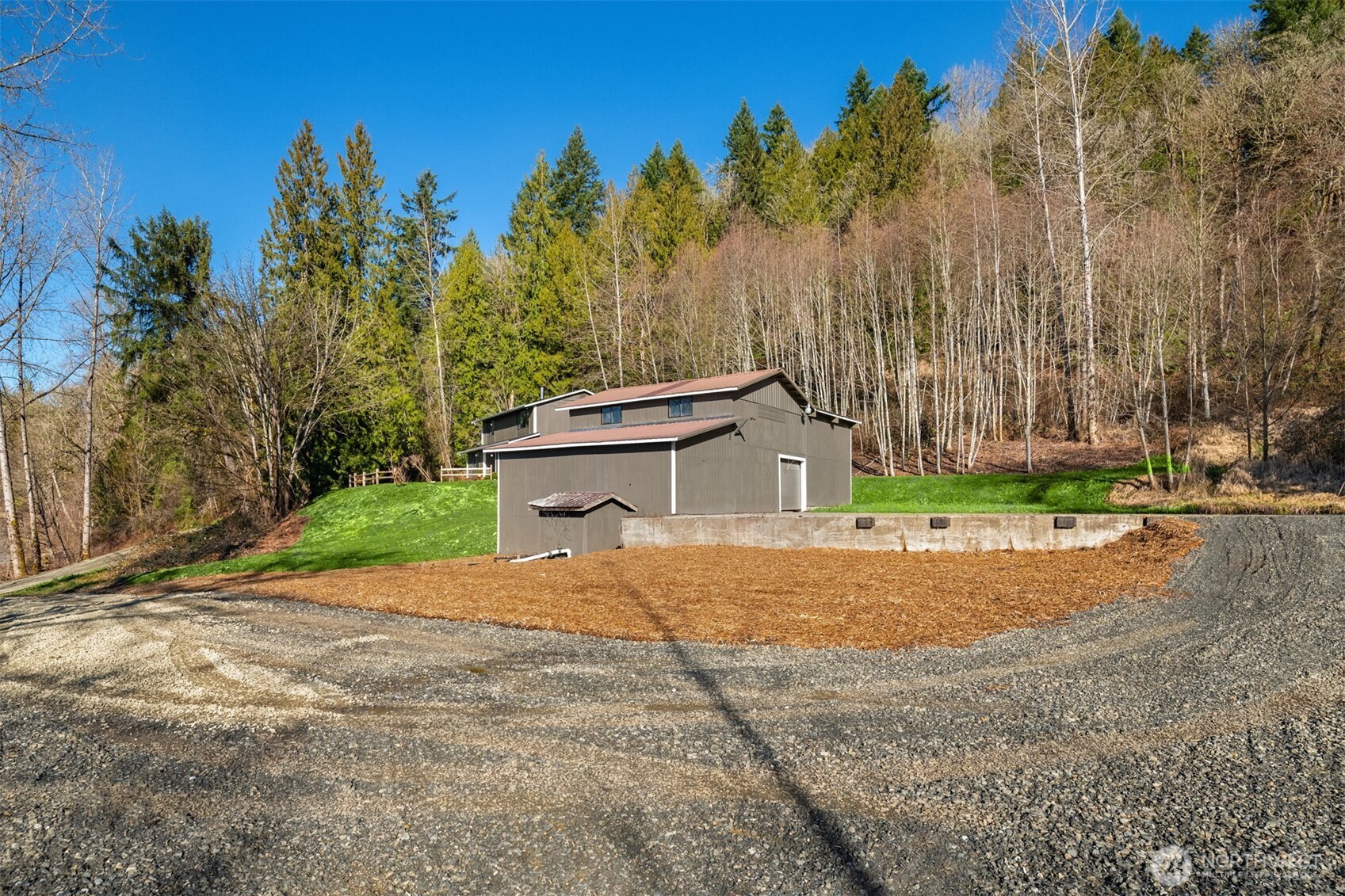 10304 296th Avenue Northeast Carnation, WA 98014 - Photo 6 of 35 a backyard of a house with lots of green space