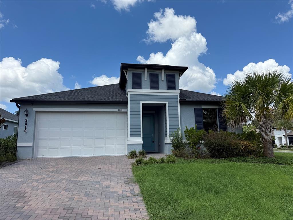 a front view of house with yard and trees