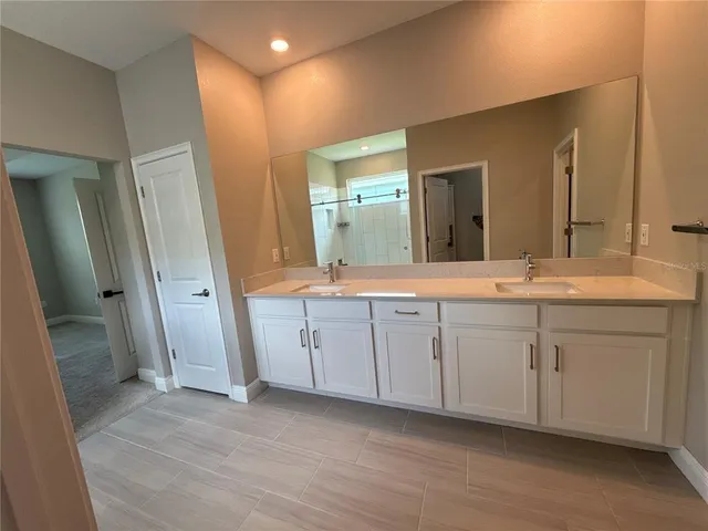 a white toilet sitting next to a small sink