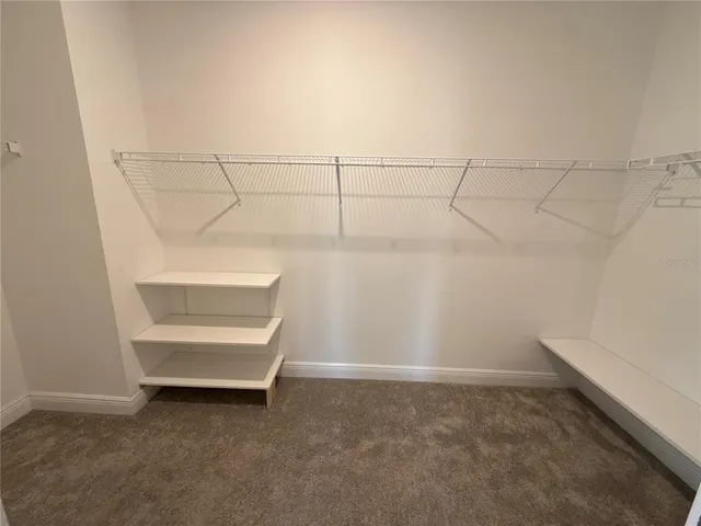 a view of a house with backyard and garden