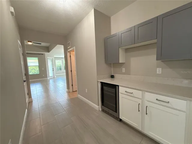 a view of a kitchen with electric appliances