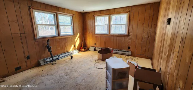 a view of walk in closet with clothes