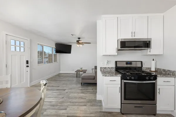 a kitchen with a stove and a microwave