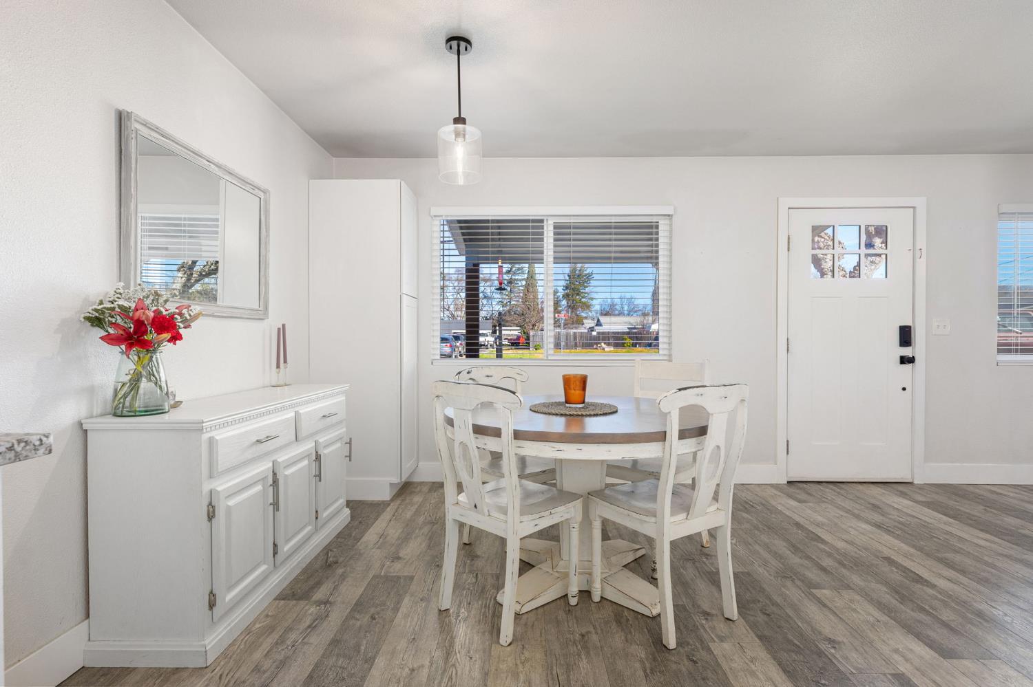 30 3rd Avenue Isleton, CA 95641 - Photo 13 of 42 a view of a dining room with furniture and wooden floor
