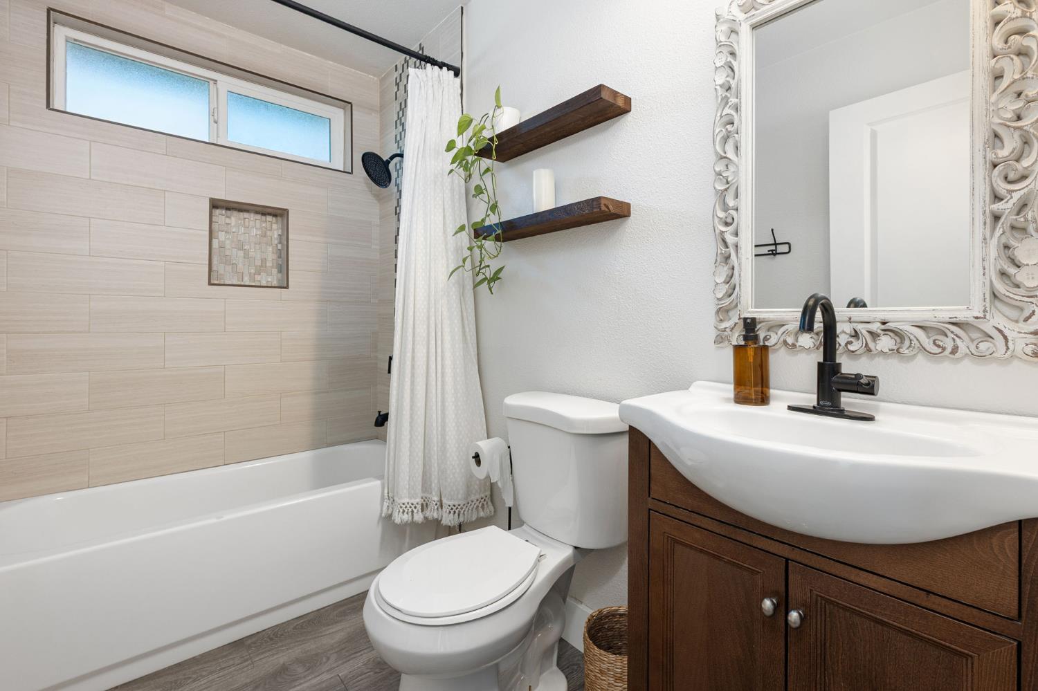 30 3rd Avenue Isleton, CA 95641 - Photo 19 of 42 a white toilet sitting next to a bath tub