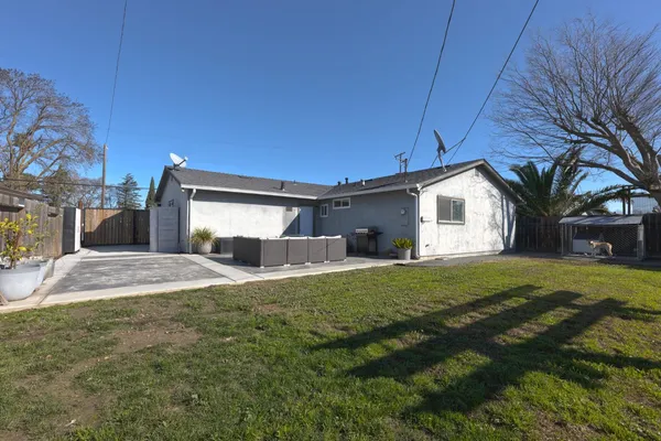 a front view of house with yard and trees