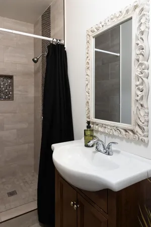 a bathroom with a sink and a mirror