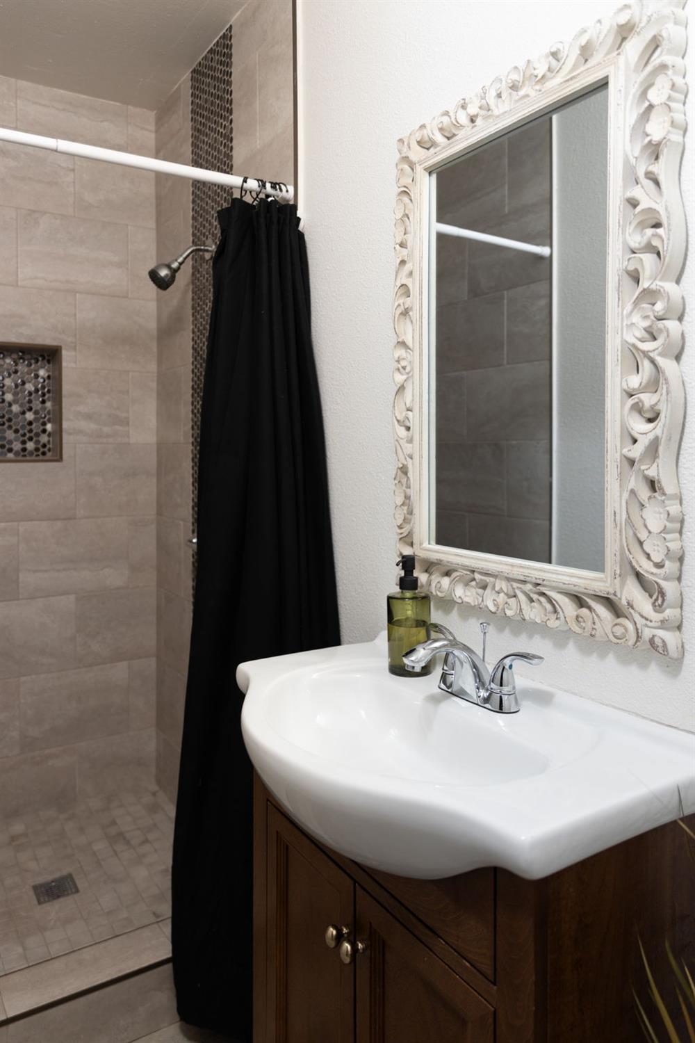30 3rd Avenue Isleton, CA 95641 - Photo 33 of 42 a bathroom with a sink and a mirror