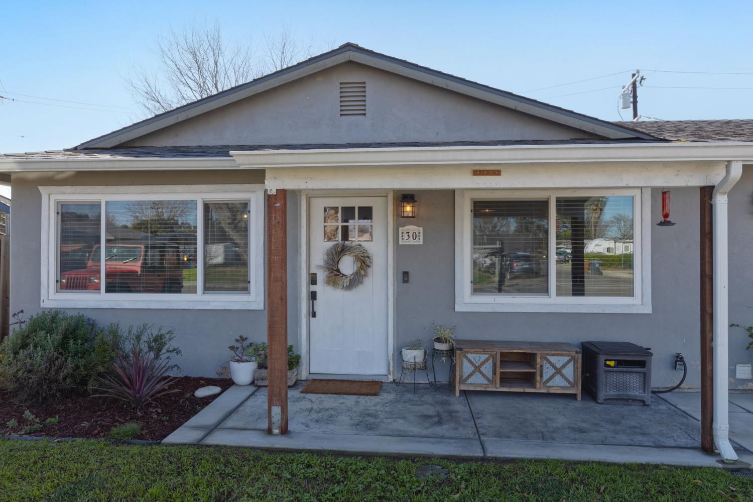 30 3rd Avenue Isleton, CA 95641 - Photo 4 of 42 a front view of a house with garden