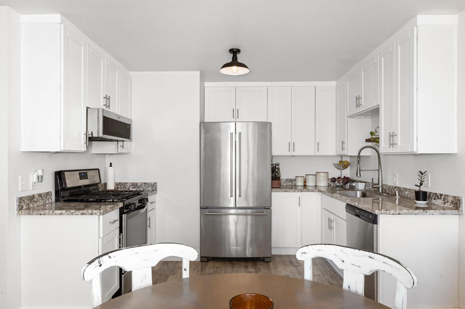 30 3rd Avenue Isleton, CA 95641 - Photo 10 of 42 a kitchen with a refrigerator stove top oven and sink