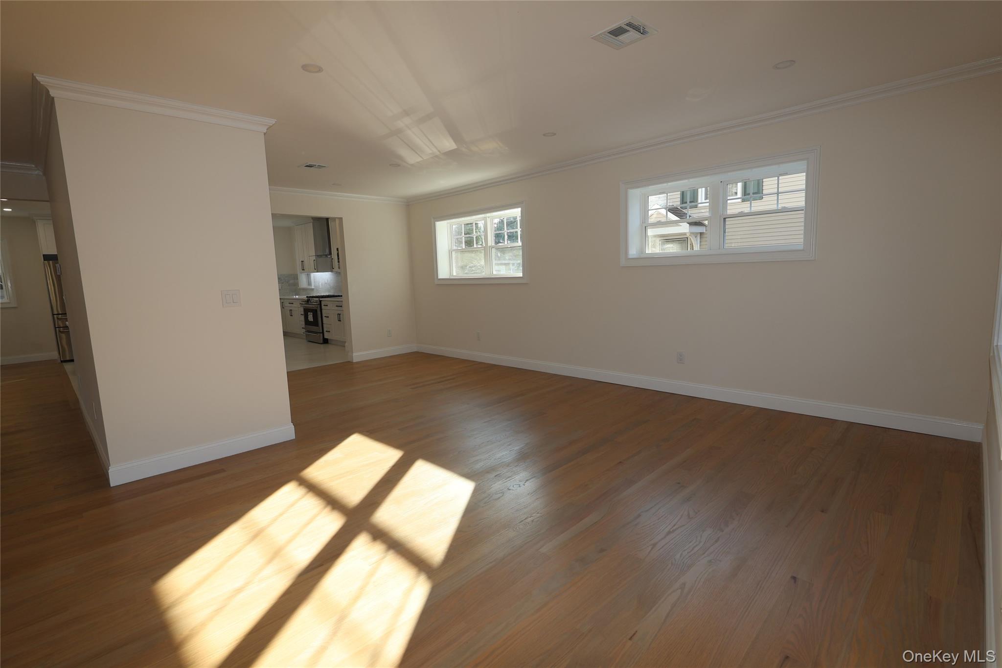 78 Ontario Road Floral Park, NY 11001 - Photo 12 of 38 a view of empty room with wooden floor and fan