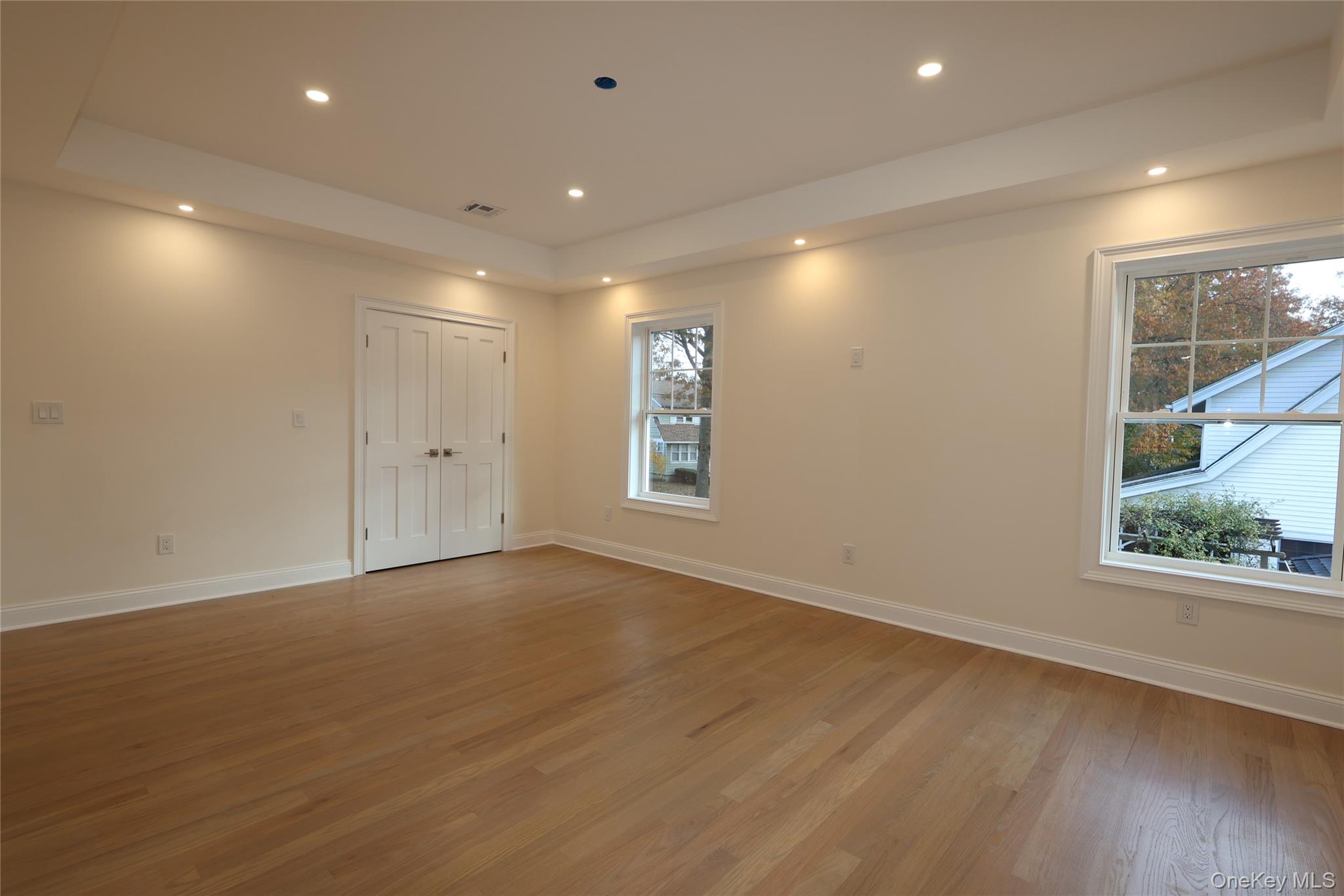 78 Ontario Road Floral Park, NY 11001 - Photo 13 of 38 a view of an empty room with wooden floor and a window