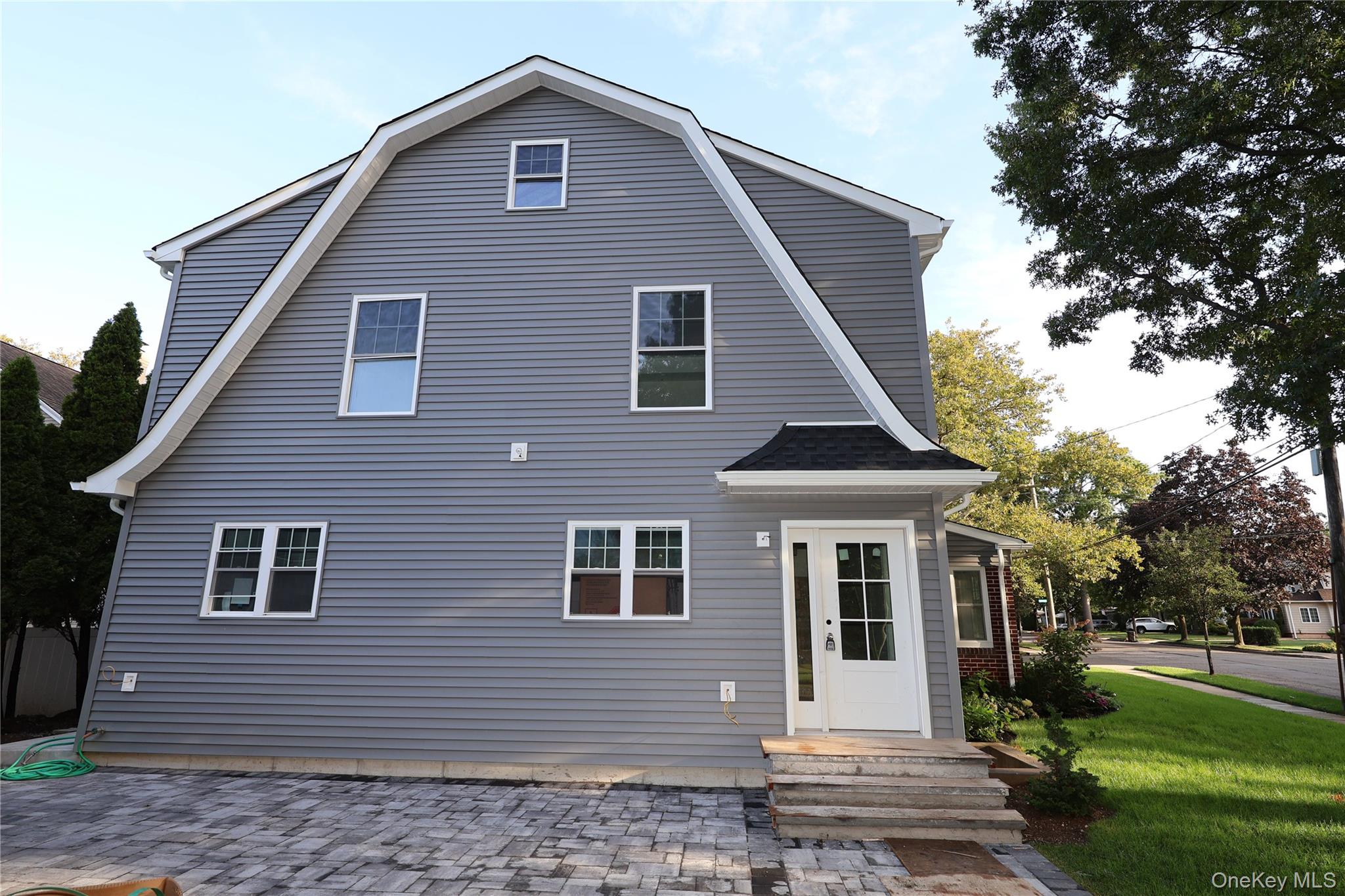 78 Ontario Road Floral Park, NY 11001 - Photo 33 of 38 a front view of a house with a yard