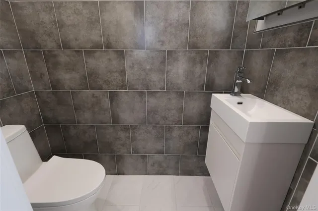 a bathroom with a sink and toilet