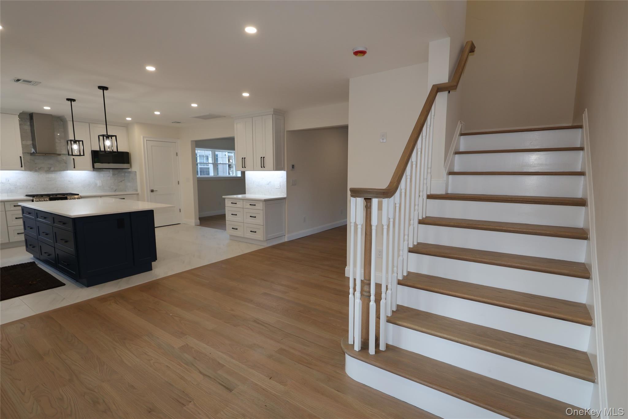 78 Ontario Road Floral Park, NY 11001 - Photo 10 of 38 a view of kitchen with sink and wooden floor