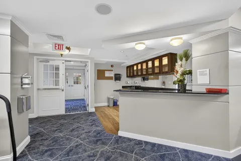 a bathroom with a granite countertop shower