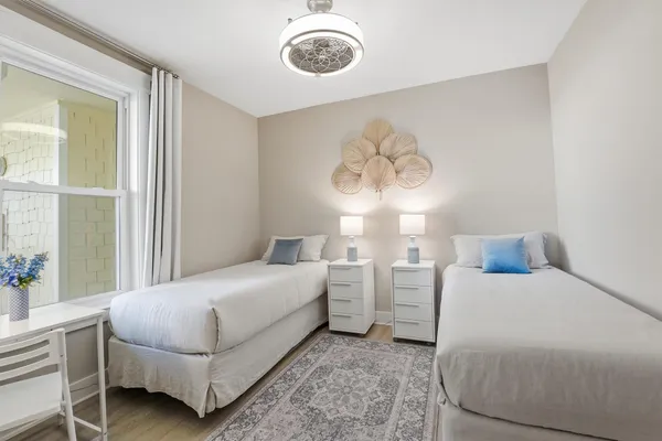 a bedroom with bed and a window