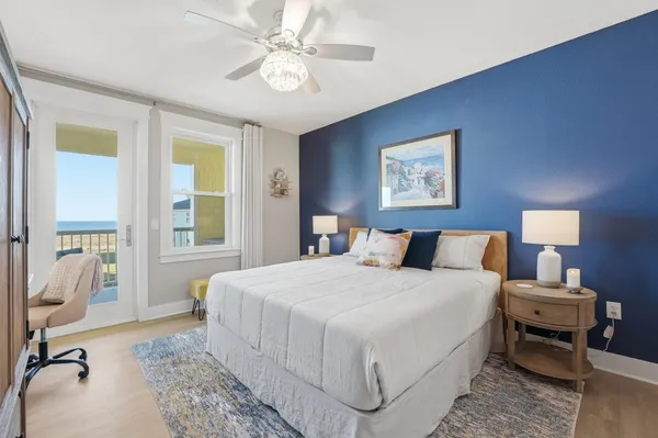 a bedroom with a bed a table and chair