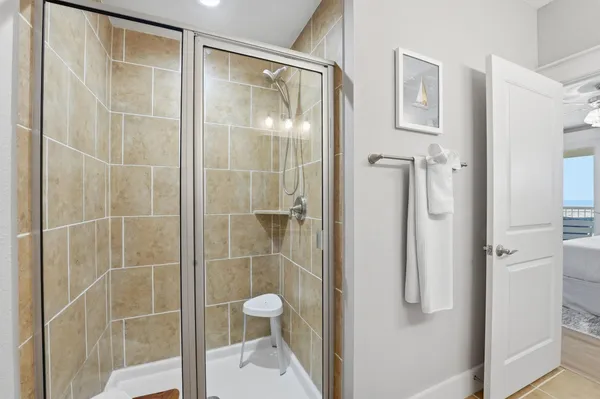 a bathroom with a shower and a sink