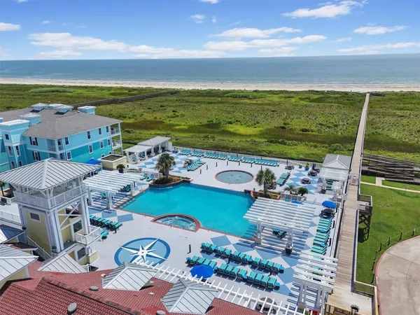 an aerial view of a house with a ocean view