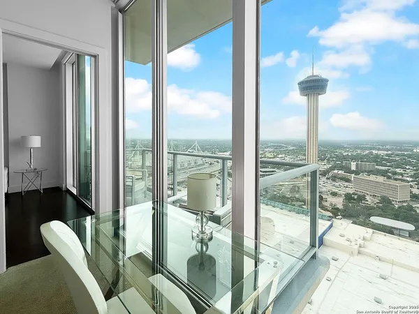a view of a living room and floor to ceiling window