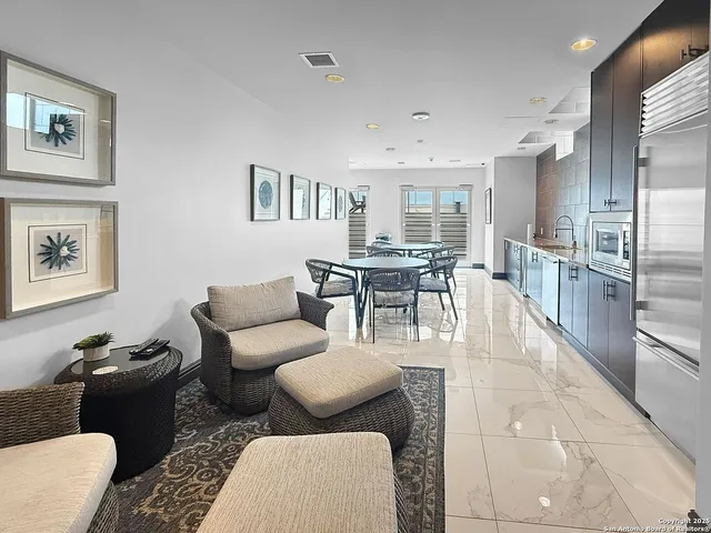 a living room with furniture and a table