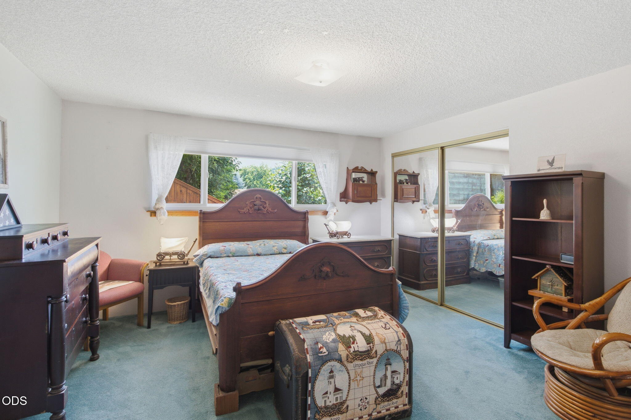 103 Brookside Court Rogue River, OR 97537 - Photo 14 of 27 a bedroom with a bed and wooden floor