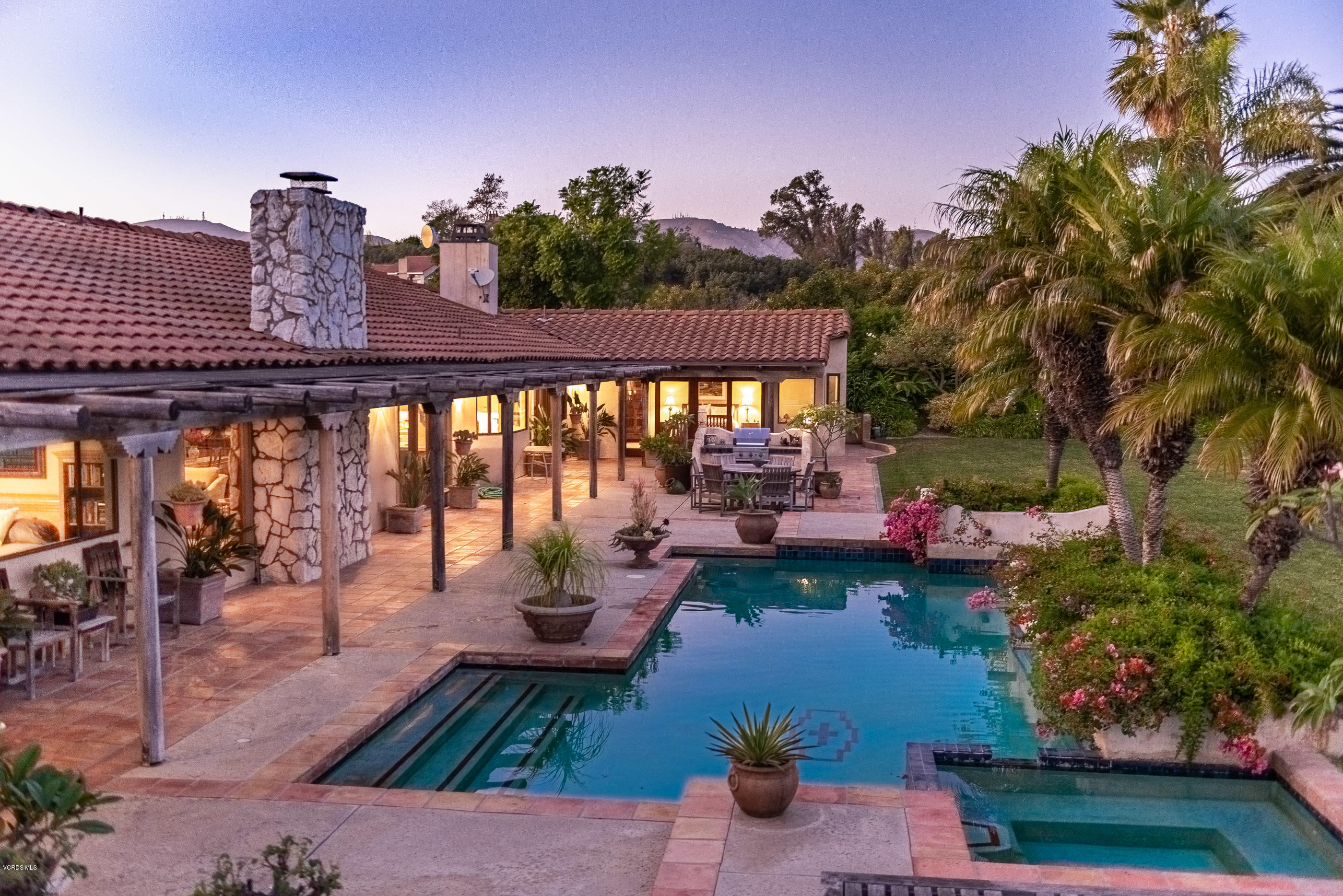 6138 West Greentree Drive Somis, CA 93066 - Photo 1 of 61 a view of a patio with couches table and chairs and potted plants