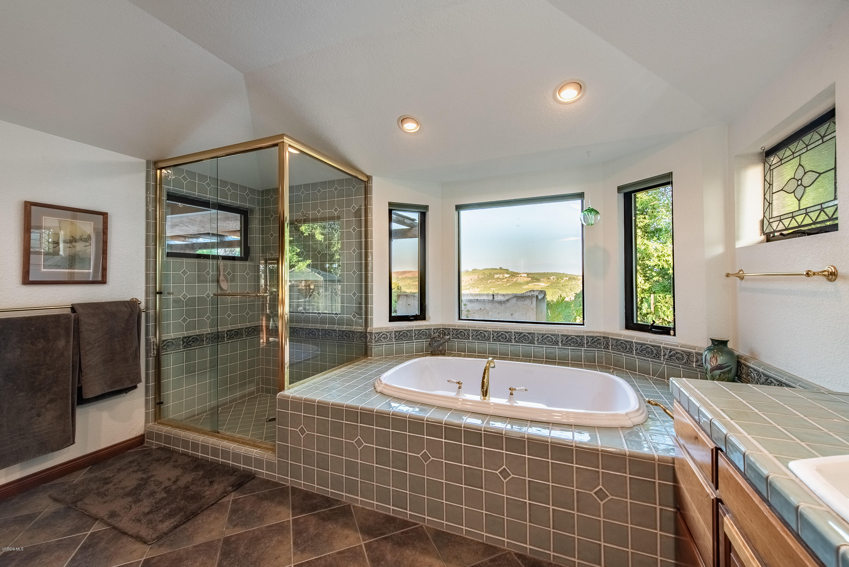 6138 West Greentree Drive Somis, CA 93066 - Photo 22 of 61 a bathroom with a tub a window and a shower