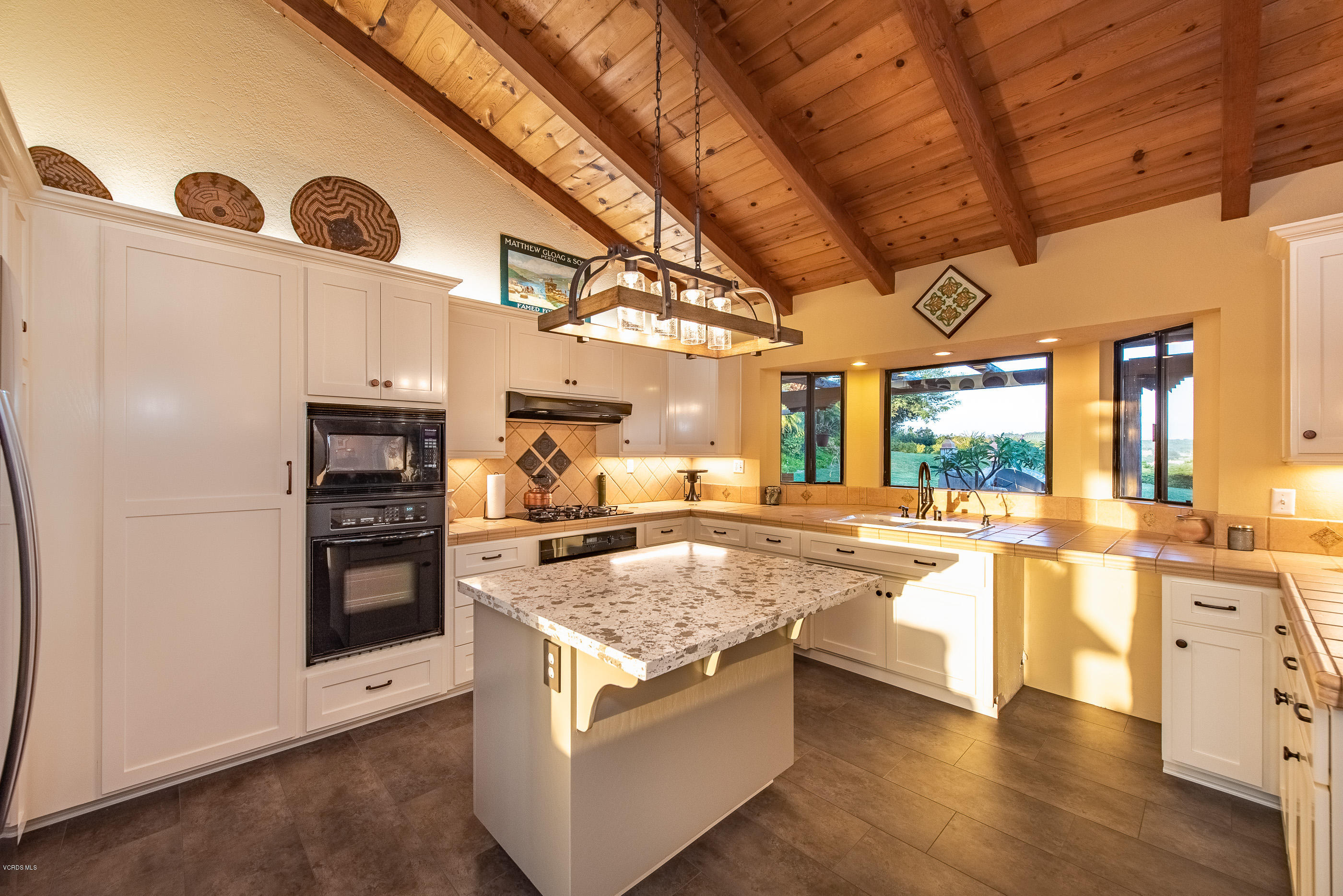 6138 West Greentree Drive Somis, CA 93066 - Photo 35 of 61 a kitchen with stainless steel appliances granite countertop a stove and a refrigerator