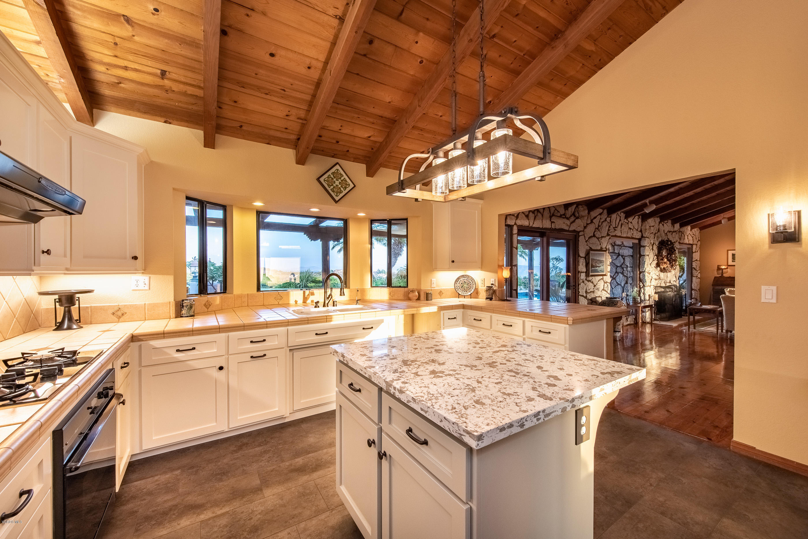 6138 West Greentree Drive Somis, CA 93066 - Photo 36 of 61 a kitchen with a stove and chandelier