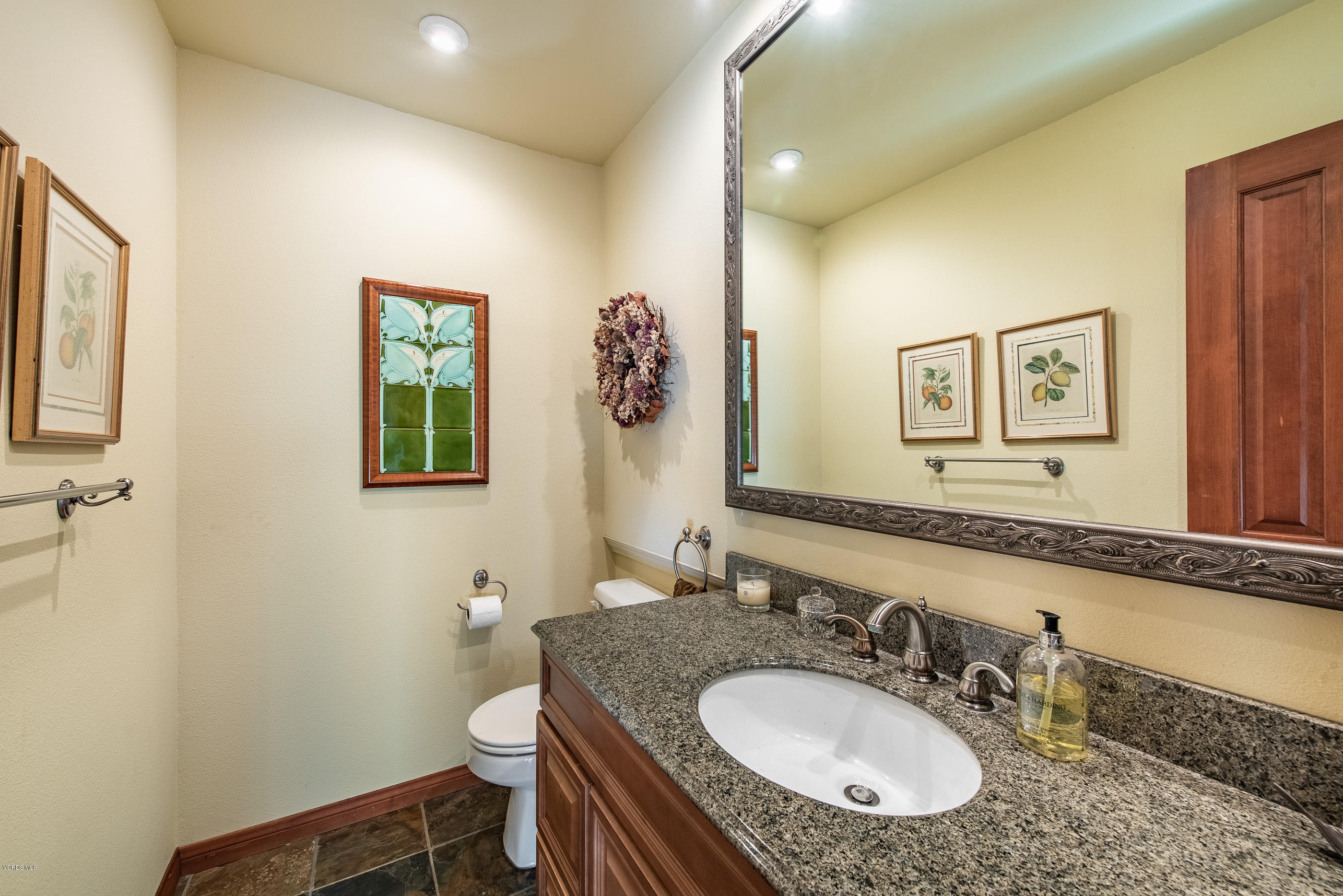 6138 West Greentree Drive Somis, CA 93066 - Photo 41 of 61 a bathroom with a granite countertop sink mirror and toilet