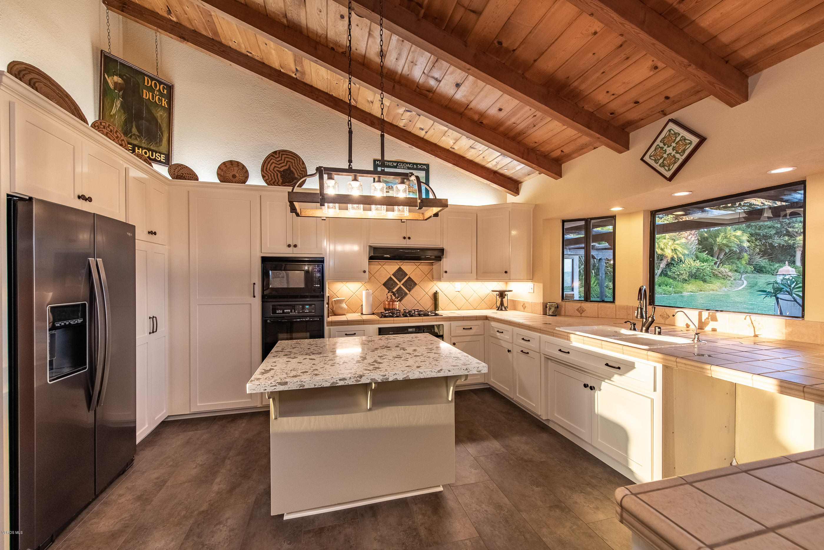 6138 West Greentree Drive Somis, CA 93066 - Photo 6 of 61 a large kitchen with stainless steel appliances granite countertop a sink stove and refrigerator